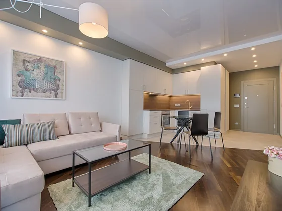 Custom recessed and accent lighting installed in a modern living room by a licensed electrician